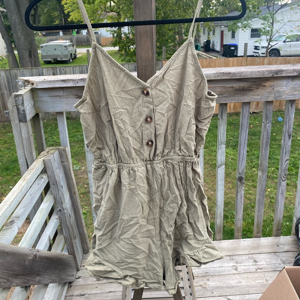 Green romper with flares around thigh